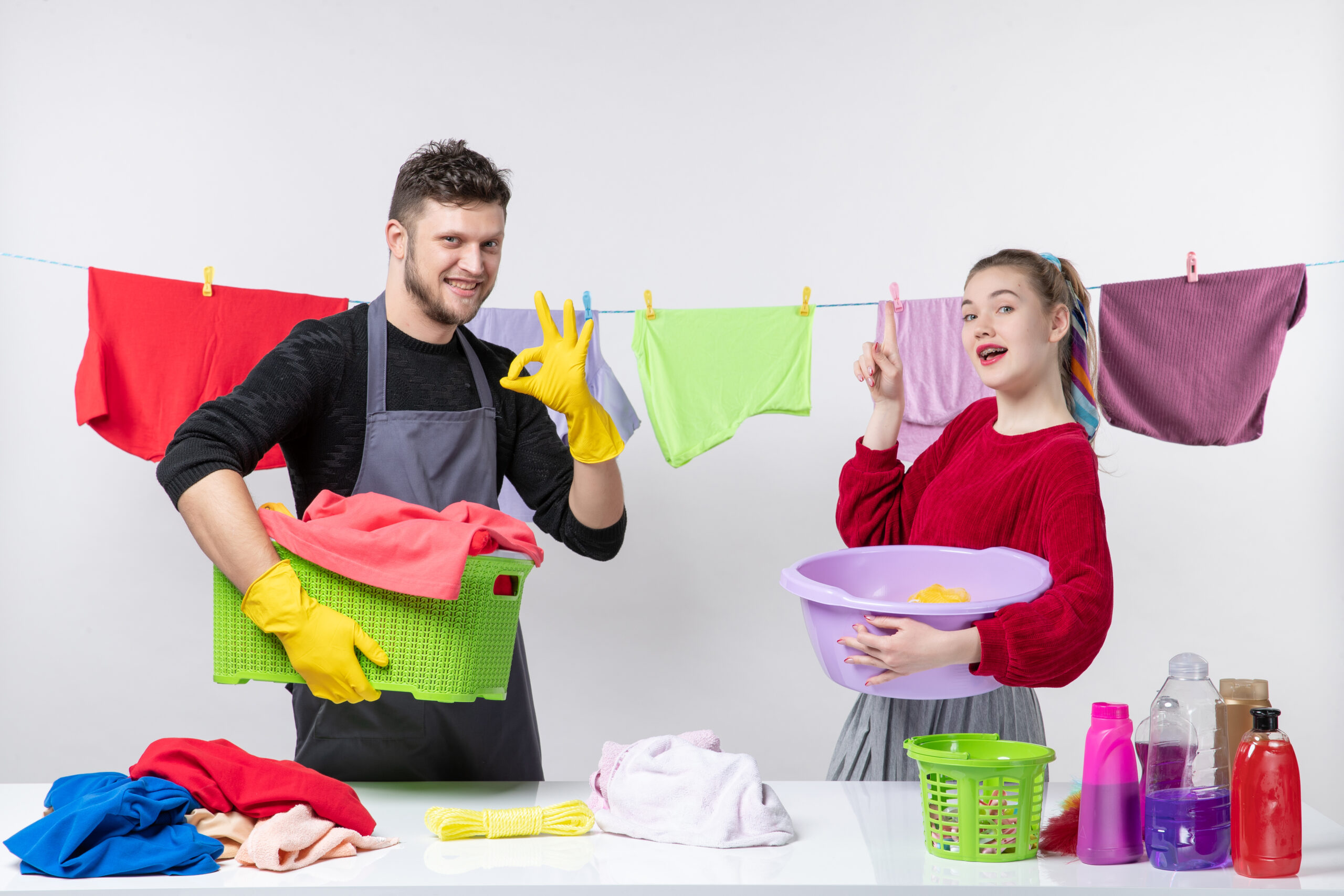 Couple with laundry baskets